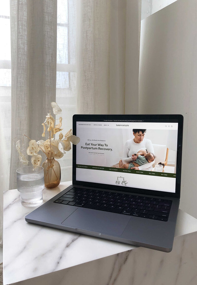 A preview of a wellness brand on shopify for women on a marble countertop